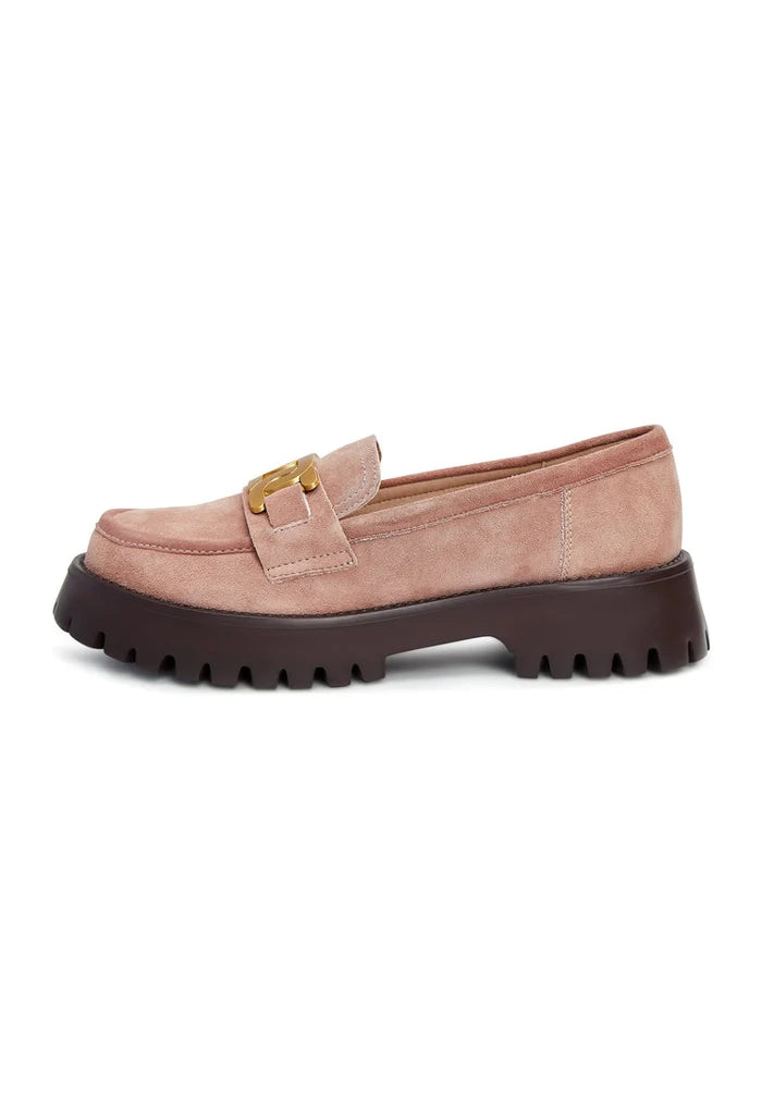 A trendy pair of women's chunky suede loafers in pink with a stylish golden chain detail.