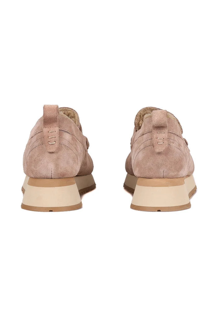 A pair of stylish beige suede platform loafers for women, combining comfort and style in one fashionable choice.