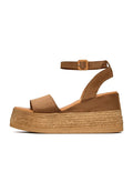 A stylish pair of women's bronze suede platform sandals, a trendy choice for any outfit.