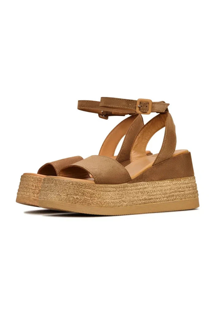A trendy pair of bronze suede platform sandals for women.
