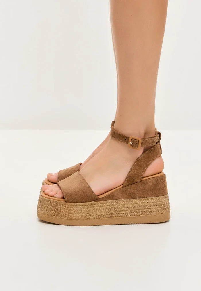 A trendy pair of women's platform sandals in bronze suede finish, perfect for adding a touch of style to any outfit.