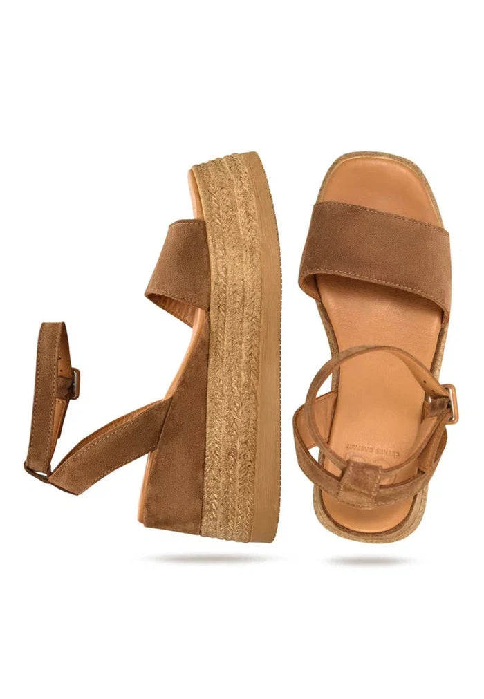 A stylish pair of bronze suede platform sandals for women, perfect for a trendy and chic look.