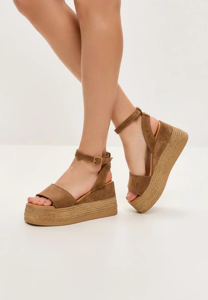 A stylish pair of women's platform sandals in trendy bronze suede design.