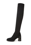 A pair of high-quality black suede shoes, perfect for a sophisticated and elegant look with a black dress.