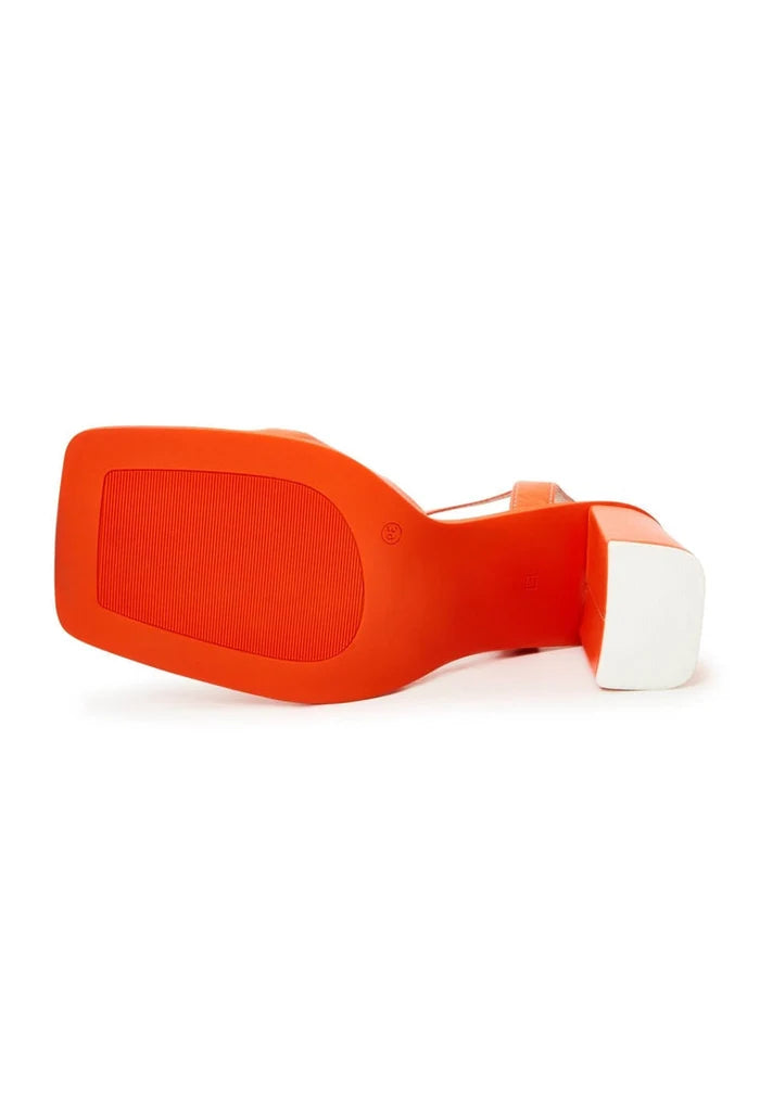 A pair of stylish orange block heels, a classic must-have for timeless women's fashion with a touch of elegance and sophistication.