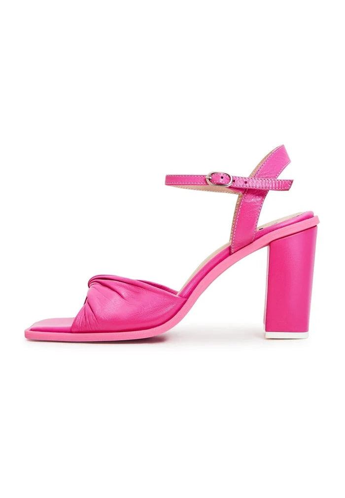 A stylish pair of timeless pink block heels, perfect for any classic look.