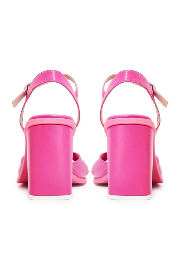 Elevate your style with these chic pink block heels - a timeless and stylish choice for any occasion.