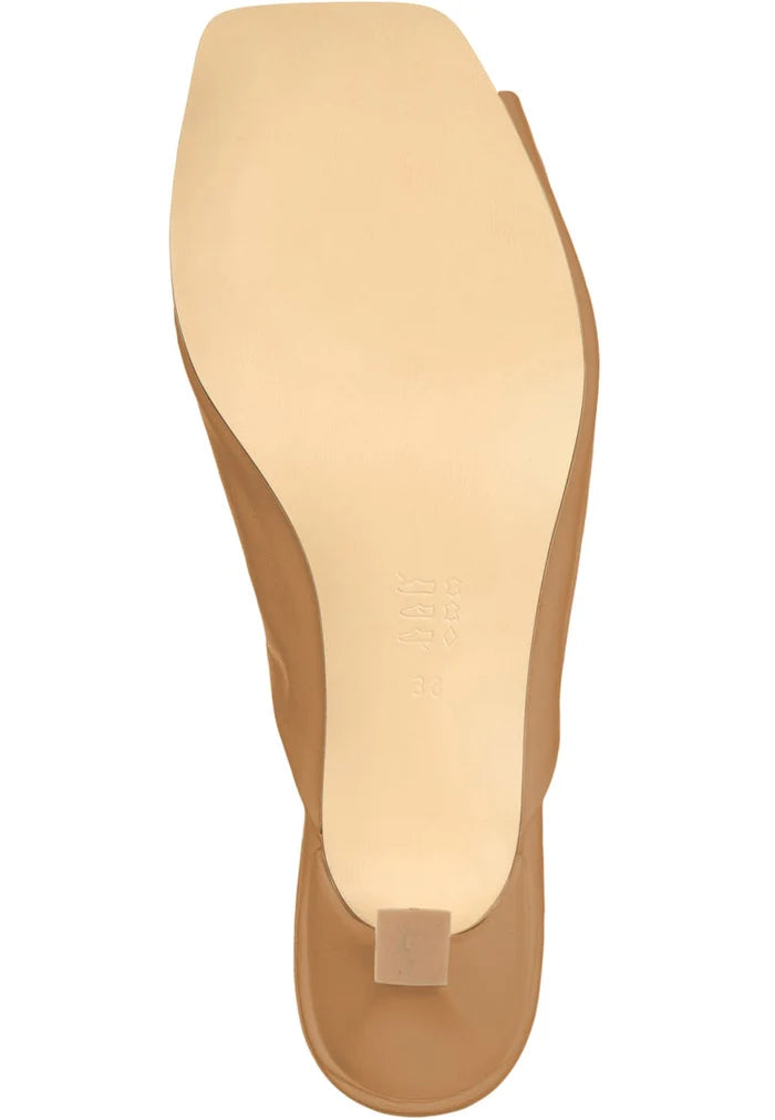 A stylish pair of Twist Luxe brown high heels for women, representing luxury and fashion.