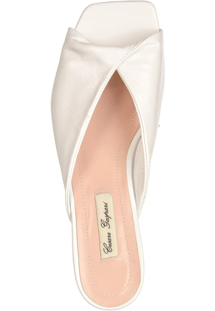 A stylish pair of white twist luxe heels with a chic twist design, perfect for any outfit or occasion.