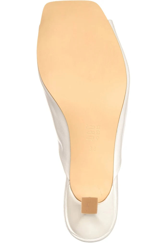 A pair of elegant white twist luxe heels with a chic and sophisticated design.
