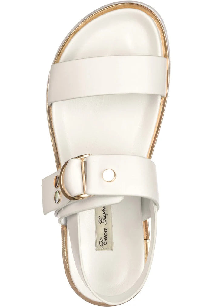 A stylish pair of urban white buckle sandals, perfect for women looking for trendy summer footwear.