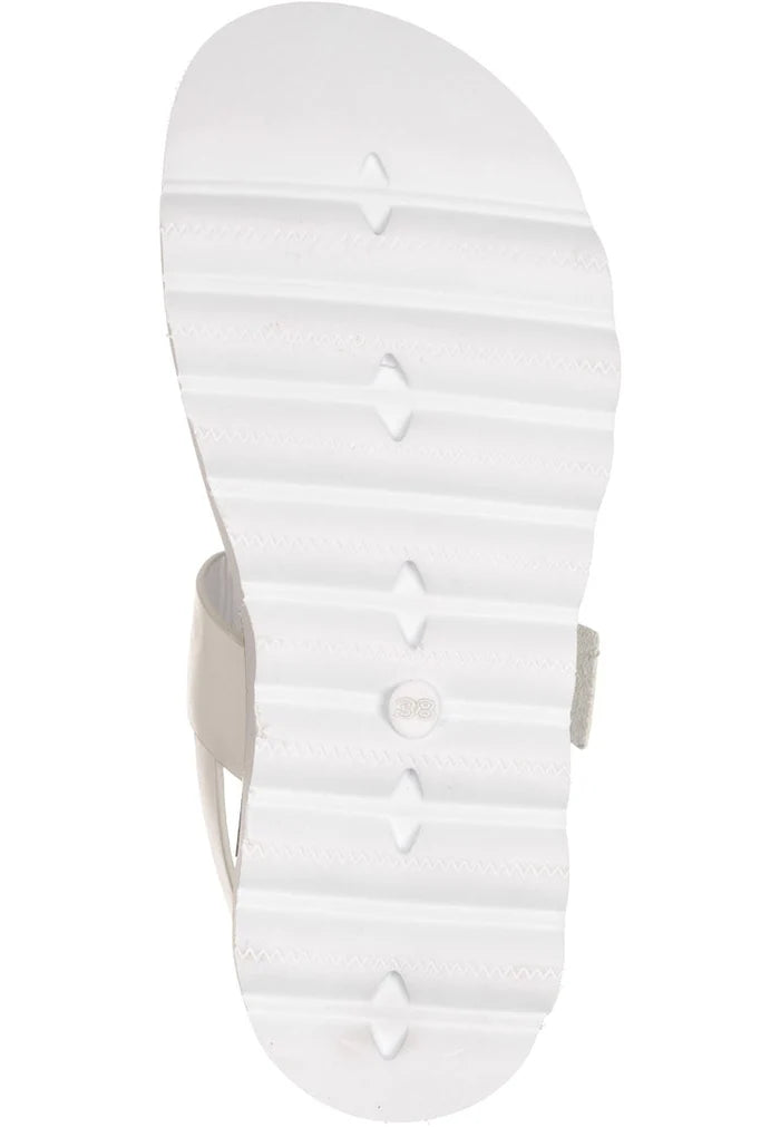 A stylish pair of white buckle sandals, perfect for urban outings. These fashionable women's white sandals are the ultimate trendy summer footwear choice.