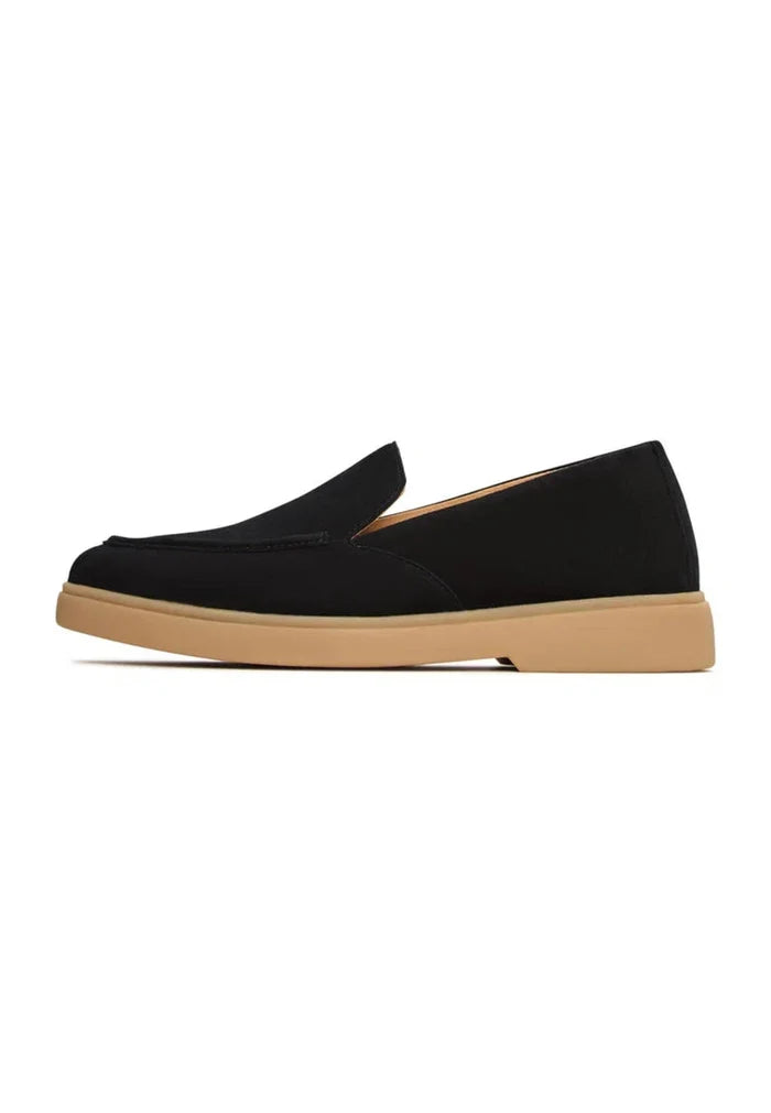 A pair of stylish and comfortable black men's loafers perfect for urban ease.