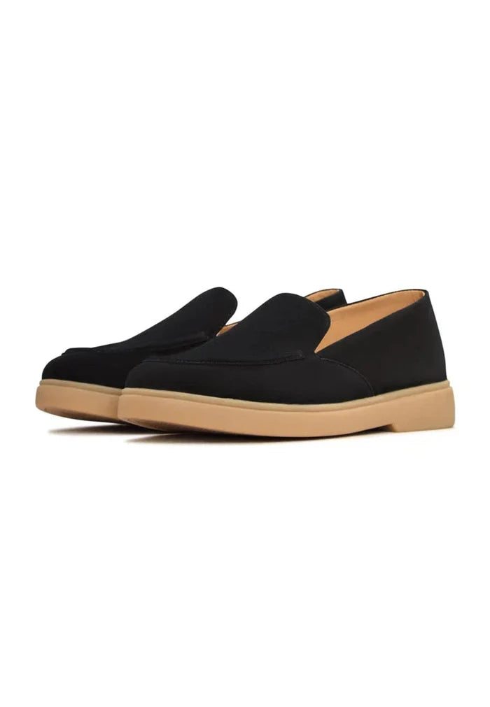 A stylish pair of comfortable black Urban Ease loafers for men.