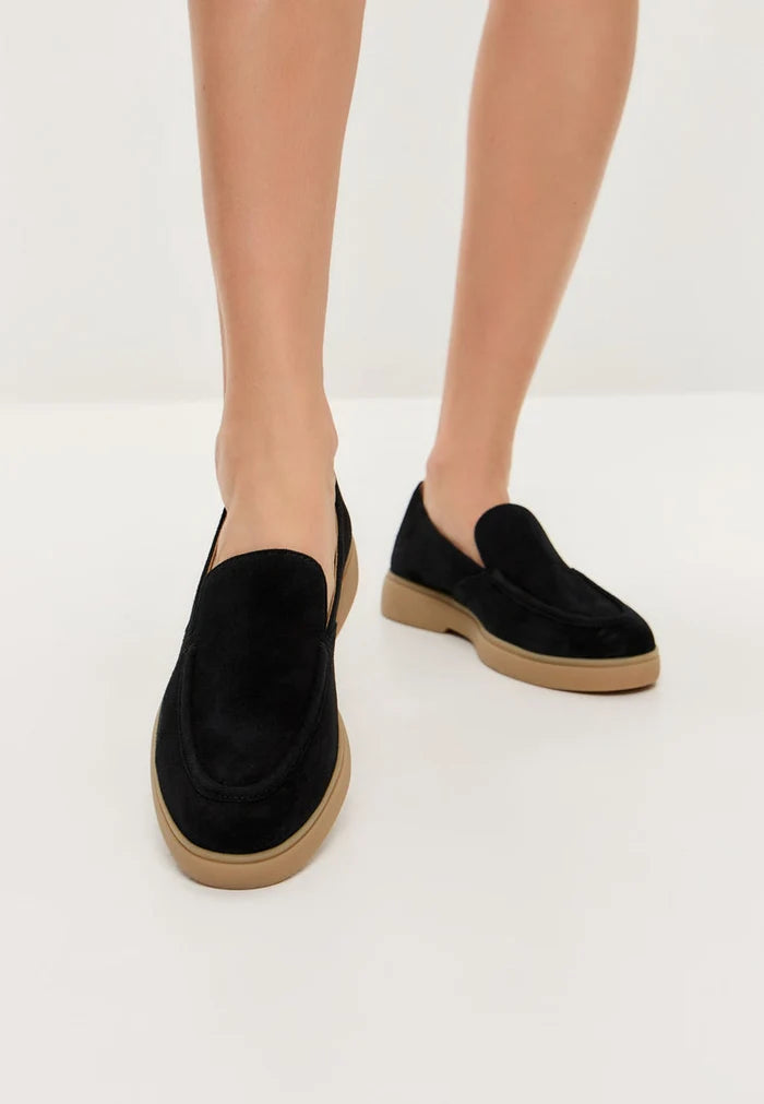 A stylish pair of urban ease black loafers, perfect for men looking for comfortable and trendy footwear.