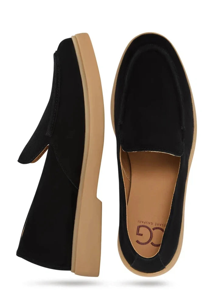 A pair of stylish and comfortable men's black loafers, perfect for urban ease.