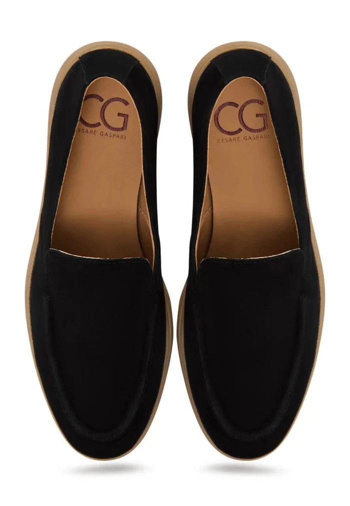 A stylish and comfortable pair of black Urban Ease loafers for men.