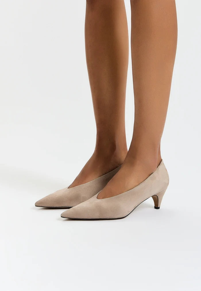 A stylish pair of beige curve pumps, a must-have in every woman's collection of fashion footwear, these designer pumps are the perfect choice for women's heels enthusiasts.