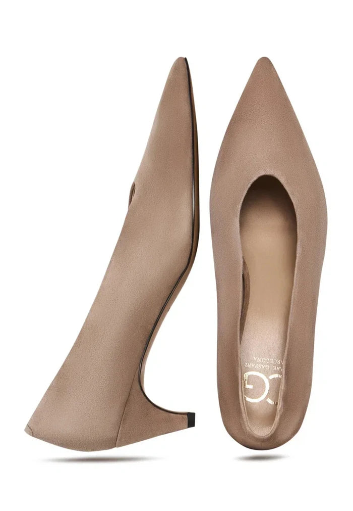 A pair of elegant designer beige curve pumps, women's heels perfect for fashion footwear aficionados.