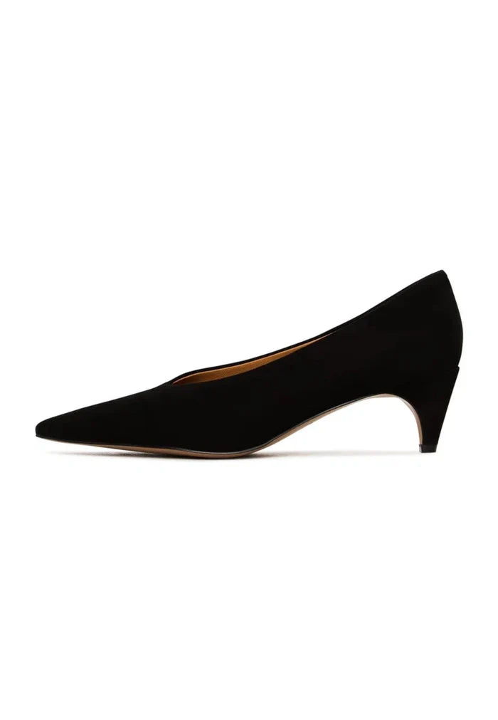 A pair of elegant black velvet curve pumps, a trendy choice in velvet footwear.