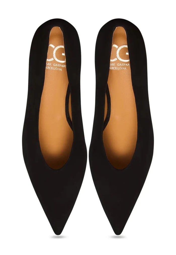 A stylish pair of elegant black velvet curve pumps, perfect for a trendy and fashionable look.