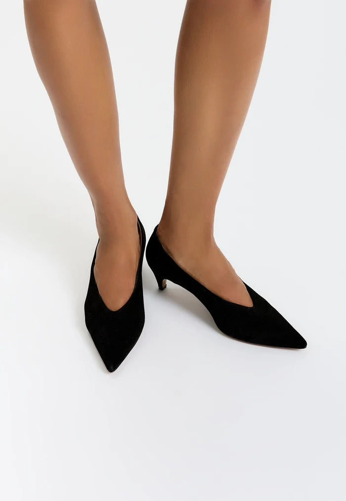 A pair of elegant black velvet curve pumps, the latest trendy footwear.