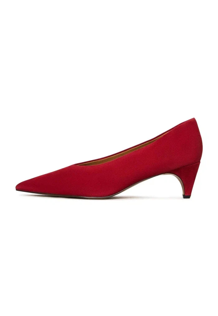 A stylish pair of red velvet pumps with a curve design, perfect for women's heels enthusiasts looking for red high heels that stand out.