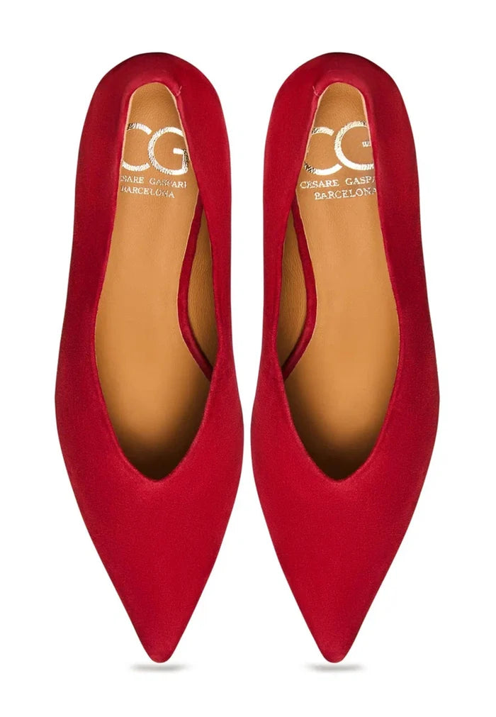 A stylish pair of red velvet curve pumps, perfect for any woman's heels collection.