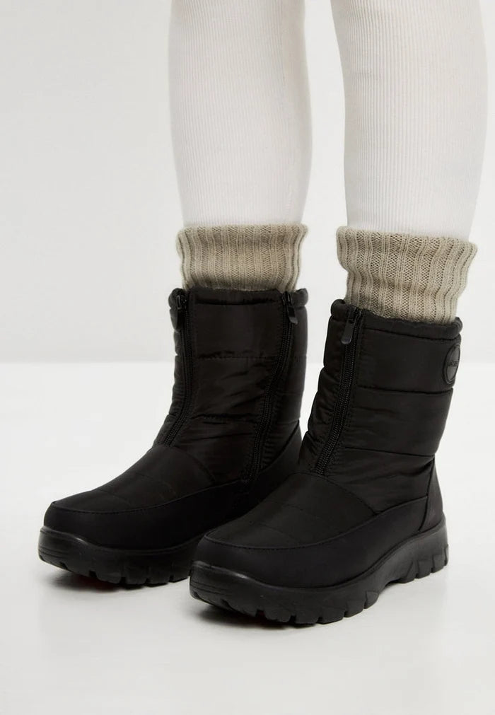 Stay warm and stylish this winter with a pair of waterproof, insulated snow boots featuring cozy fur lining and snow grips for added traction in cold weather.