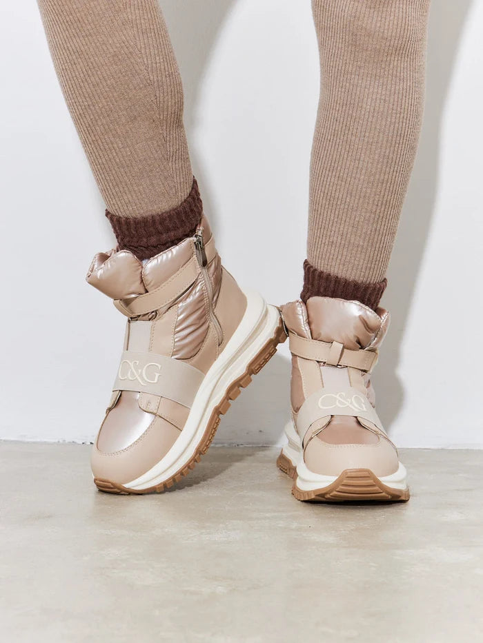 A stylish pair of beige winter ankle boots, combining the comfort of sneaker boots with the elegance of ankle booties, perfect for your winter footwear collection.