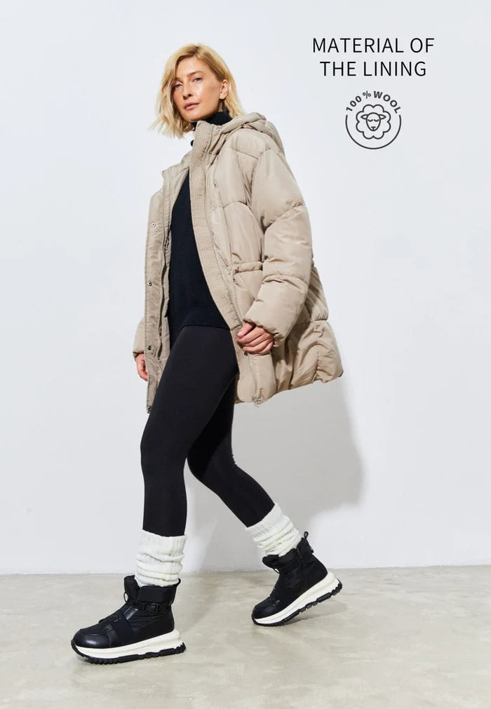 A trendy pair of black ankle sneaker boots, perfect for winter, featuring a stylish and fashionable design ideal for winter footwear.