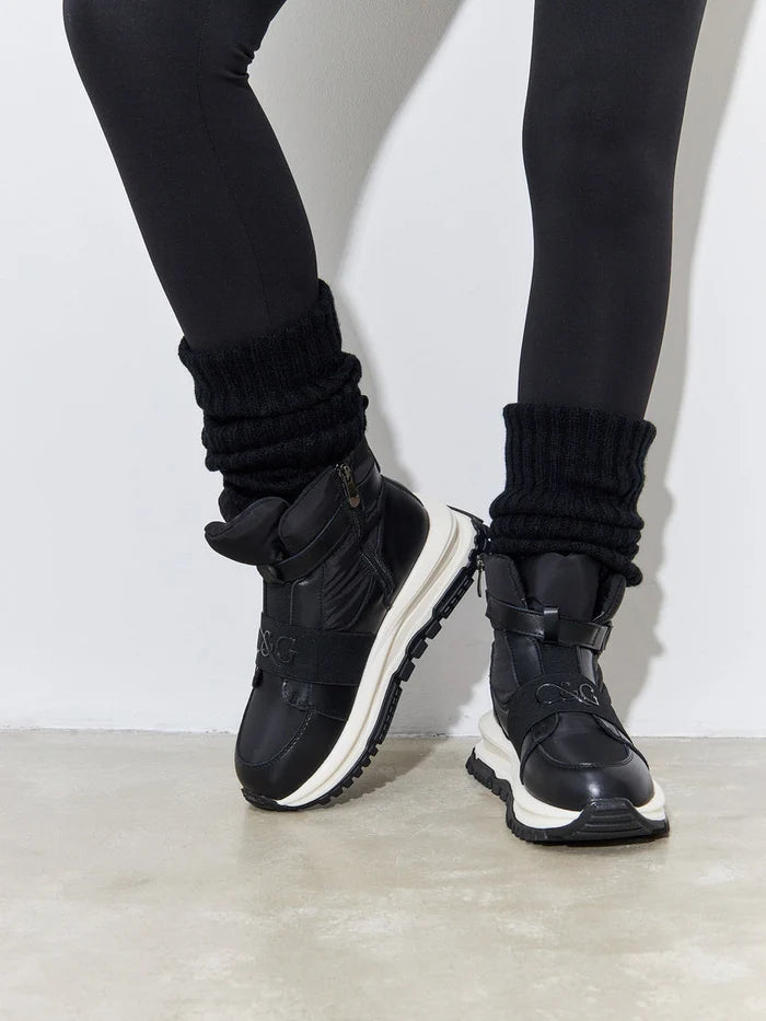 A stylish pair of black ankle sneaker boots, perfect for winter, showcasing fashionable winter footwear.