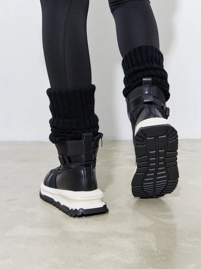 A stylish pair of black winter fashion boots, featuring ankle sneaker style, ideal for cold weather and winter outings.