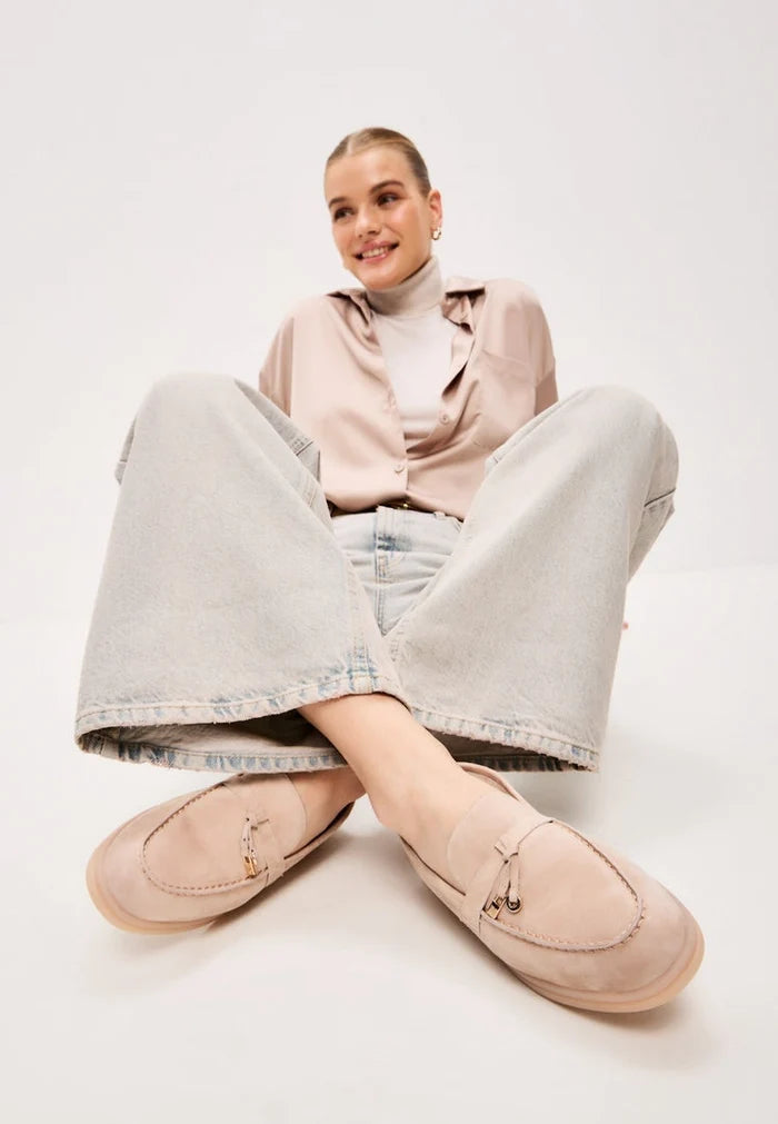 A pair of stylish beige Aemilia loafers, perfect winter shoes for women looking for cold weather footwear.