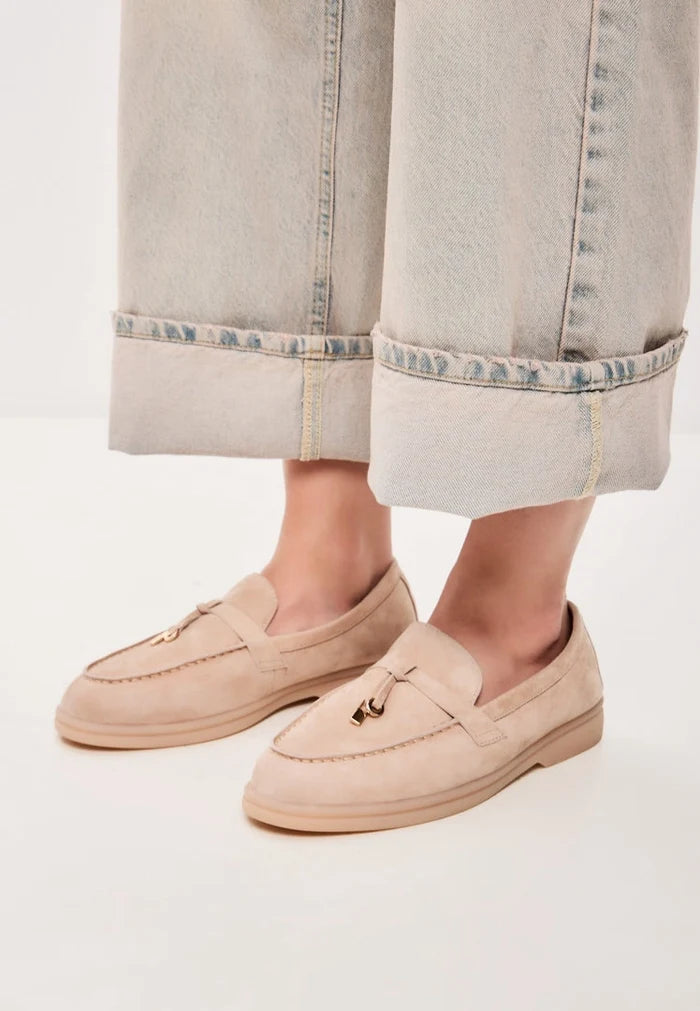 A pair of stylish beige Aemilia winter loafers for women - perfect cold weather footwear.