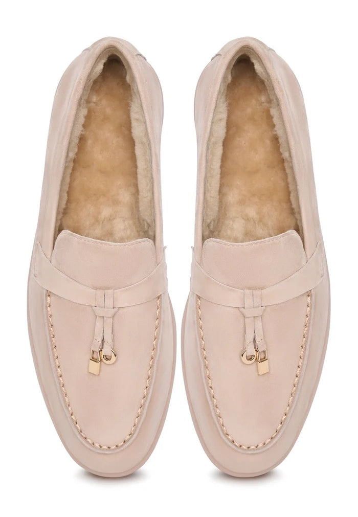 A pair of stylish beige Aemilia loafers, perfect women's winter shoes for cold weather, featuring a cozy and fashionable design for the season.