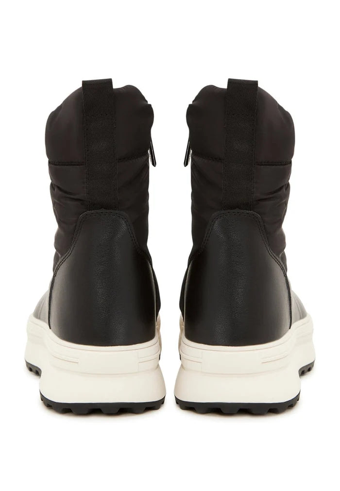 A stylish pair of black platform winter boots, perfect for staying warm and fashionable during the cold season.