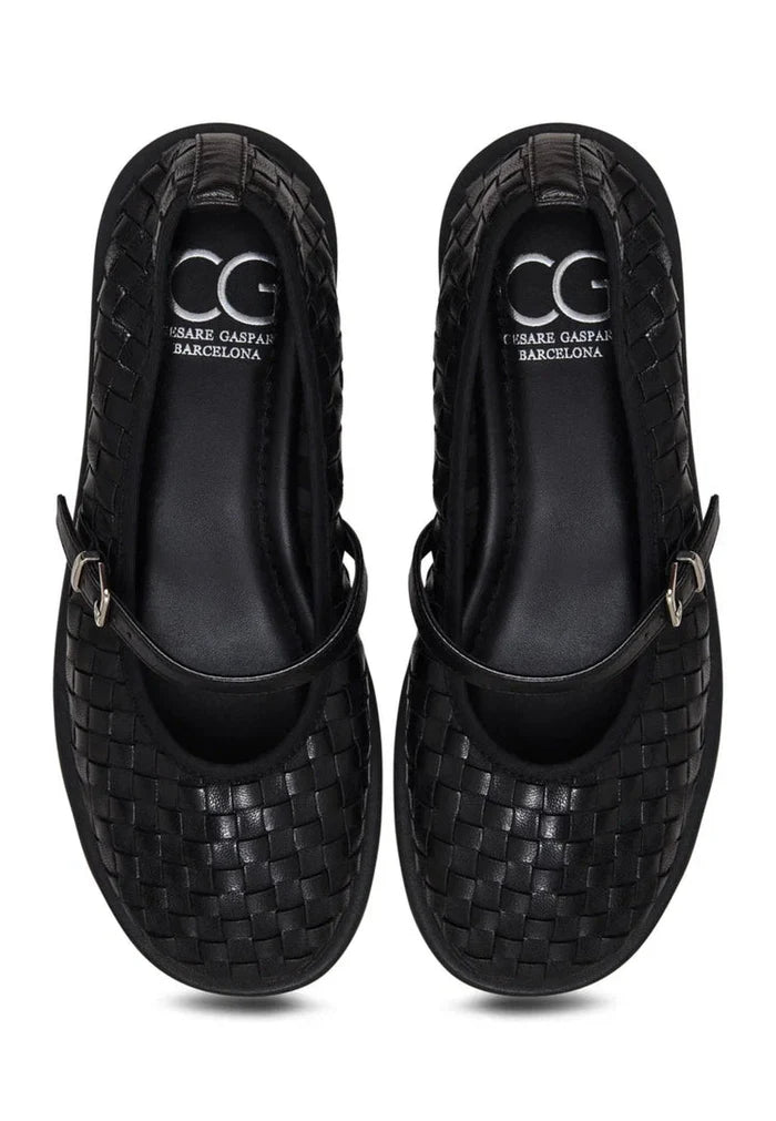 A pair of black Woven Elegance Mary Janes, stylish women's shoes that combine fashion and elegance perfectly.