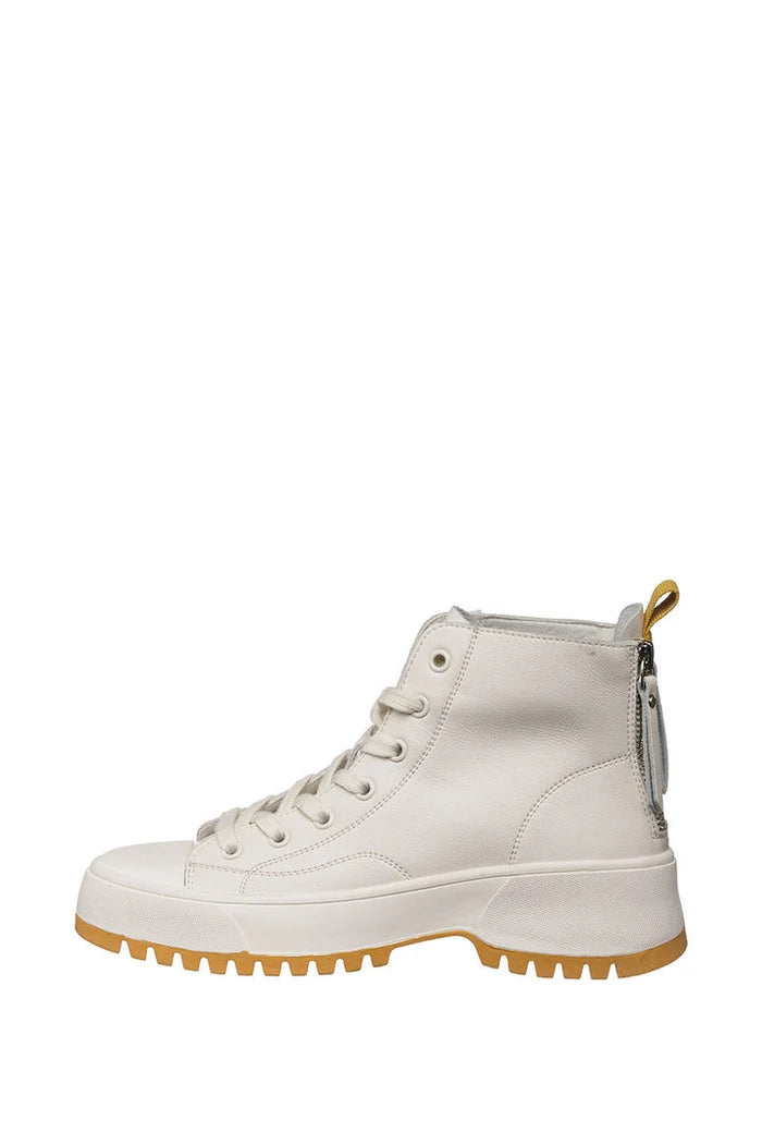 A close-up image showcasing the stylish zipper detail on a pair of leather zip boots, a perfect addition to any fashion-forward shoe collection.