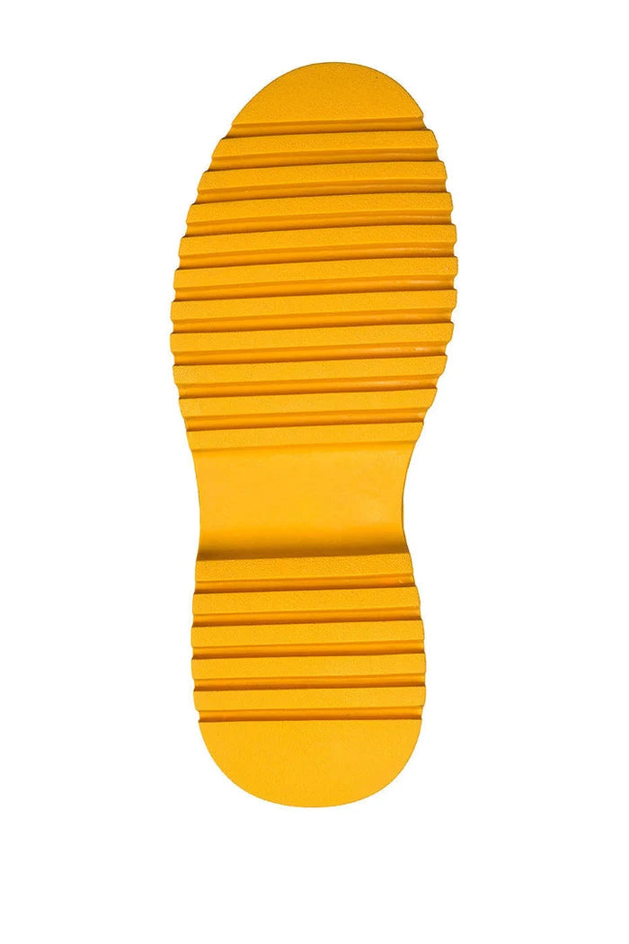 A close-up image of detail leather footwear featuring stylish leather zip front boots with intricate zipper detail, perfect for a chic and modern look.